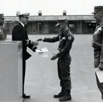 Steve Nash receiving paperwork from officer