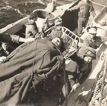 Aboard Ship With Man In Stretcher