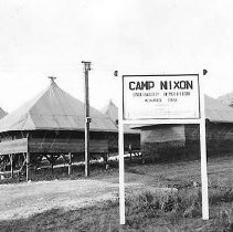 Camp Nxon Sign With Tents