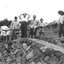 Locals On A Rock Wall