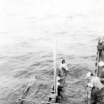 Outrigger Alongside Ship