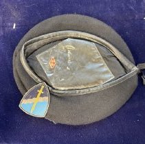 black baret hot with medal