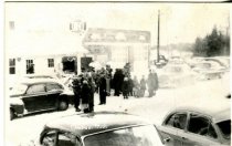 people in winter at gas station