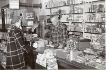 Inside the Barth store early 1950s, customer and Ernest
