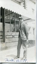 Walter Barth, brother to Ernest Barth, standing near a store in Suttons Bay