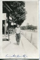 Ernest Barth on the sidewalk in front of the Barth store