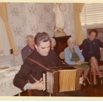 Rev. Maurice McNiff with accordion