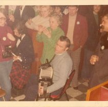 Martin McHugh plays accordion at O'Gara's on St. Patrick's Day, ca. late 19