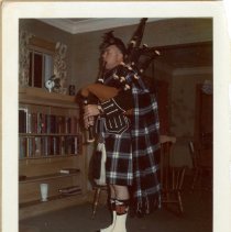 Brian Boru Irish Pipe Band member Charles Russell in non-band tartan unifor