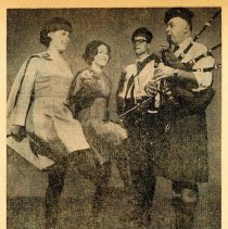 Newspaper photo of two dancers with two members of the Brian Boru Irish Pip