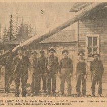 First light pole in North Bend and the installation crew