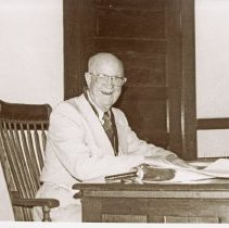 Unidentified Masonic member sitting at a table