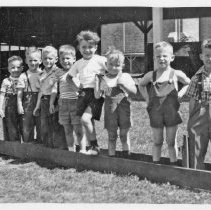 Young children by Brick School, c1949