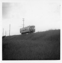 TER 'Extra' Passenger Motor 328 on Fill After Crossing MKT Tracks