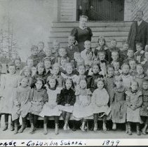First grade class and teachers in front of Columbia School in 1899