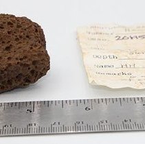 Breadloaf sinker and artifact slip