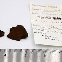 Polished adze flakes with artifact slip
