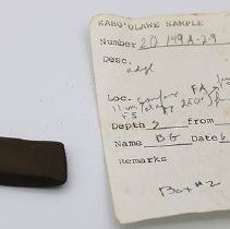 Small adze with artifact slip