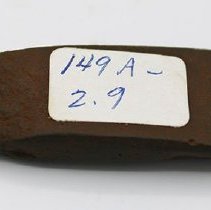 Adze with identification sticker