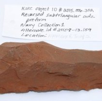 Reversed subtriangular adze preform with artifact slip