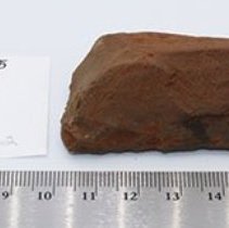 Reversed subtriangular adze preform with artifact slip