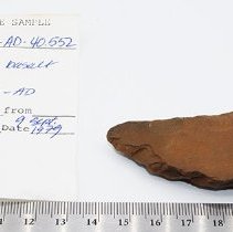 Basalt awl with artifact slip and ruler