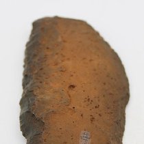 Close up of basalt knife with alternate identification number visible