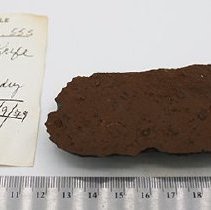 Basalt knife with artifact slip & ruler