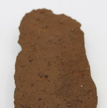 Lengthwise view of reverse side of basalt knife