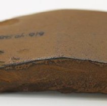 Profile of polished basalt adze fragment