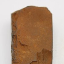 Lengthwise view of unpolished side of basalt adze fragment