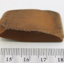 Small basalt adze (ko'i)  with ruler