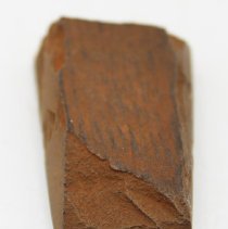 Lengthwise view of basalt adze fragment
