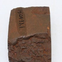 Lengthwise view of adze fragment with alternate id number visible