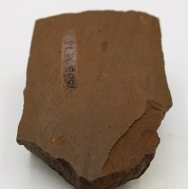 Lengthwise view of adze fragment with alternate id number visible