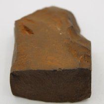 Lengthwise view of basalt adze fragment