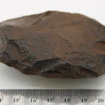 Basalt adze blank with ruler