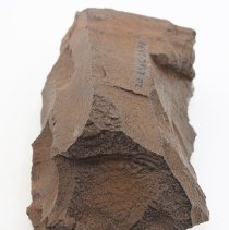 Close up lengthwise view of a basalt adze