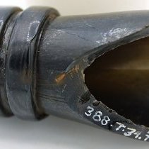 Lengthwise view of glass bottle fragment  with alternate id number visible