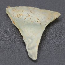 Closeup of triangular glass bottle fragment