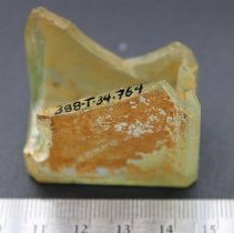 Glass bottle base fragment with ruler