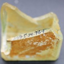 Closeup of glass bottle bottom fragment with alternate id number visible