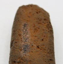 Lengthwise view of an adze preform with alternate id number visible