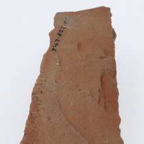 Lengthwise view of adze blank with visible alternate id number