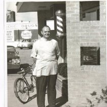 Pete Groters in Front of His Barbershop