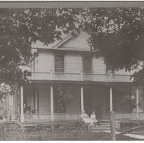 Mercy Drew Sitting in Front of her House