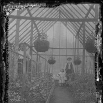 Wingrove family inside greenhouse