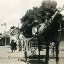 Uncle Jim and Aunt Mary with man in carriage
