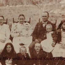 Family of three adults and six children