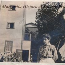 unnamed woman behind Velasco Market